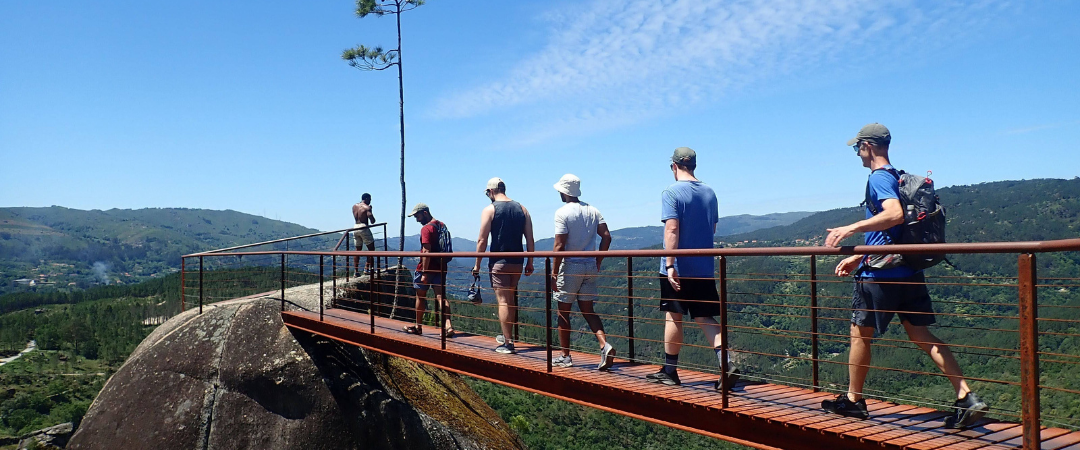people walking on a bridge
